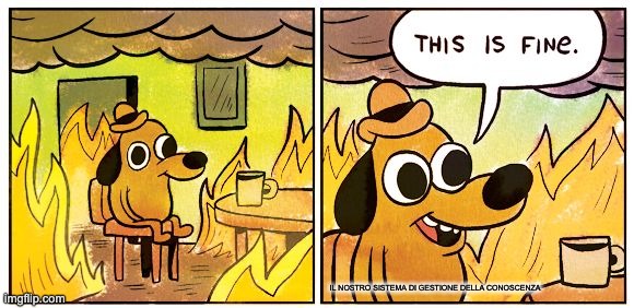 The 'this is fine' cartoon dog sitting in a burning room, captioned as our knowledge management system